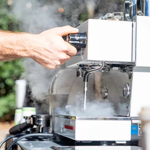 Barista pulling an espresso shot on the Cala Coffee cart
