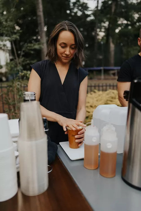 Barista preparing drinks at a Cala Coffee catering event